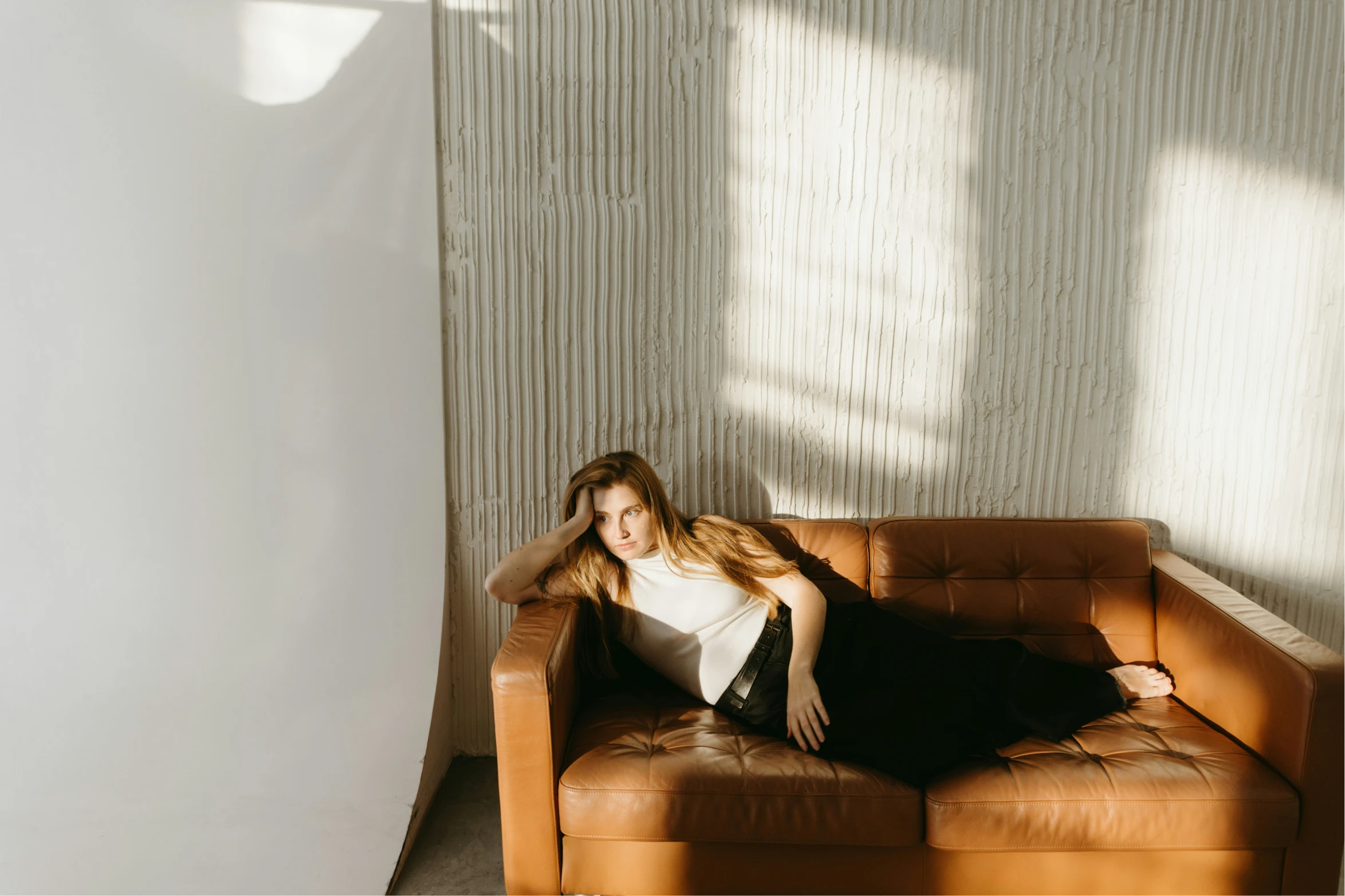 Woman relaxing at home thinking about reproductive health